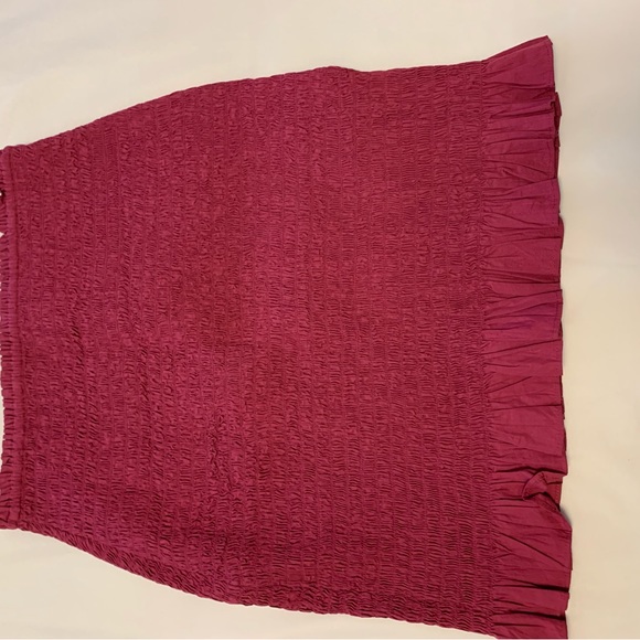 Hot pink skirt with ruffle bottom from Anthropologie. Form fitting stretch . - Picture 2 of 2